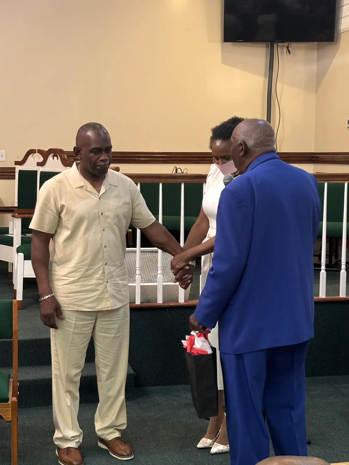 Members greeting one another at the front of the sanctuary on Easter