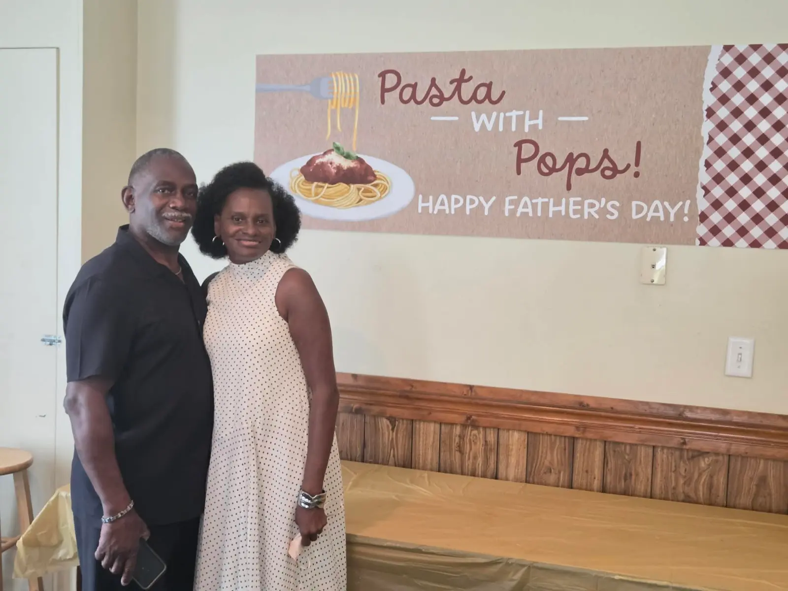 A couple smiling together at the Father's Day lunch