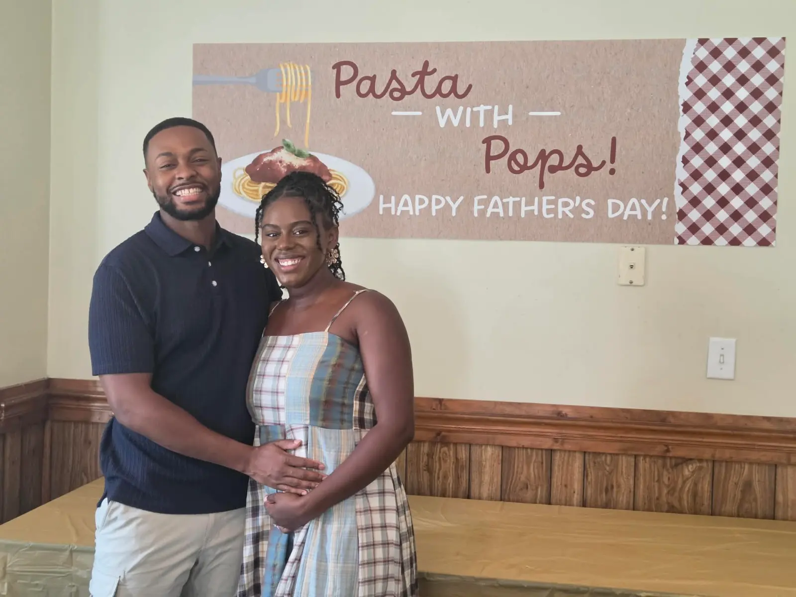 A young couple at the Pasta with Pops Father's Day celebration