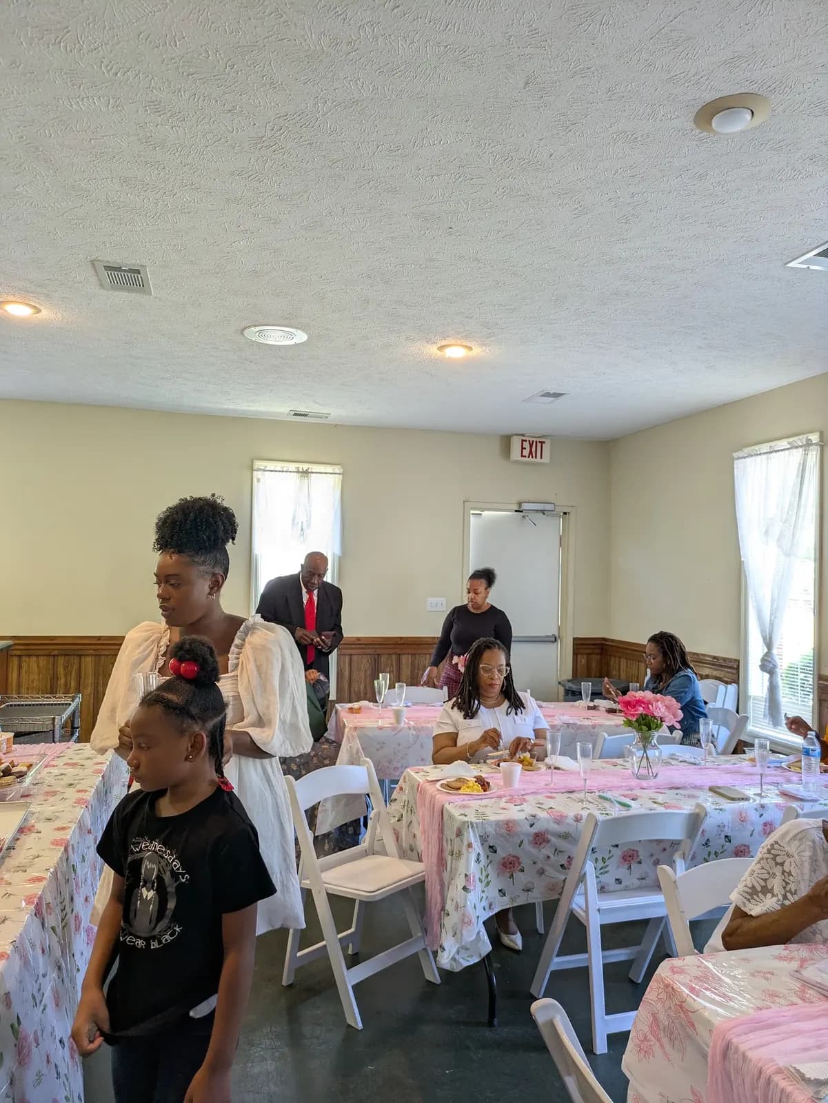 Members gathering in the fellowship hall for the Mother's Day brunch