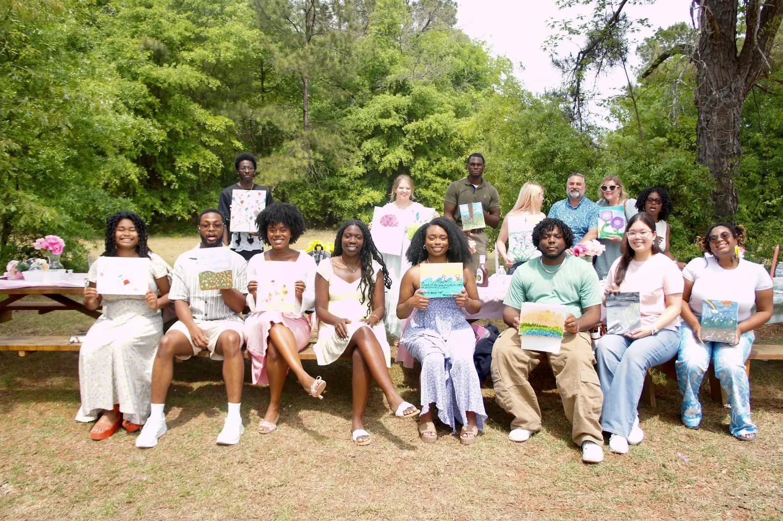 The church family gathered for a group photo in the field at the spring picnic
